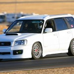 White Subaru Forester on BBS LM with Red Capson the Track