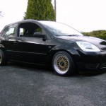 Black Ford Fiesta on Gold BBS RM